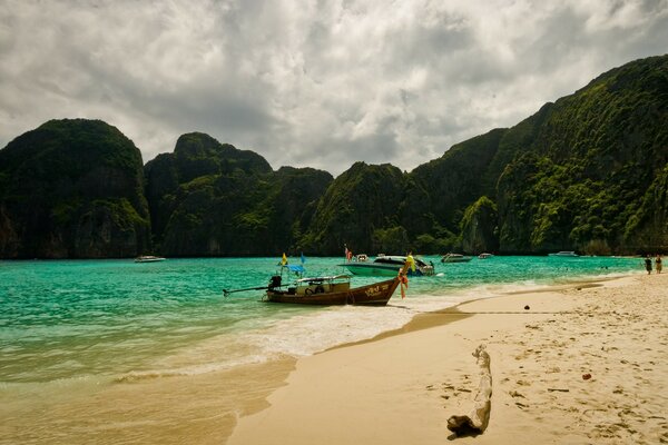 Fishing boat on the background of mountains