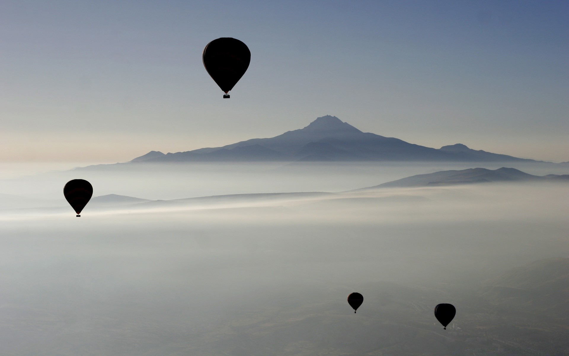 islands balloon recreation hot-air balloon sky sunset landscape water adventure dawn travel outdoors swimming mountain evening moon leisure silhouette parachute