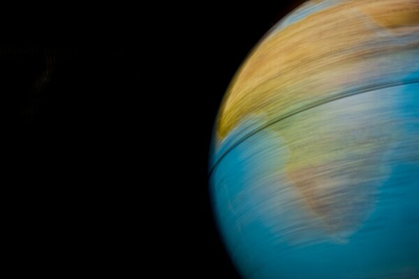 A spinning globe on a dark background