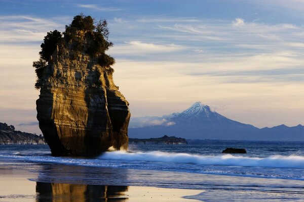 A lonely rock around the water waves