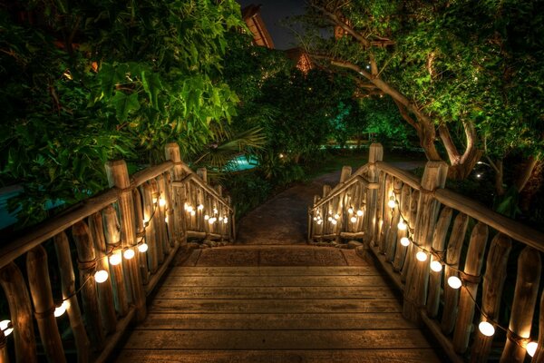 Romantic bridge with lanterns at night