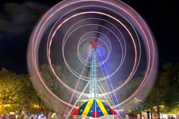 City park rides on the background of evening blurriness