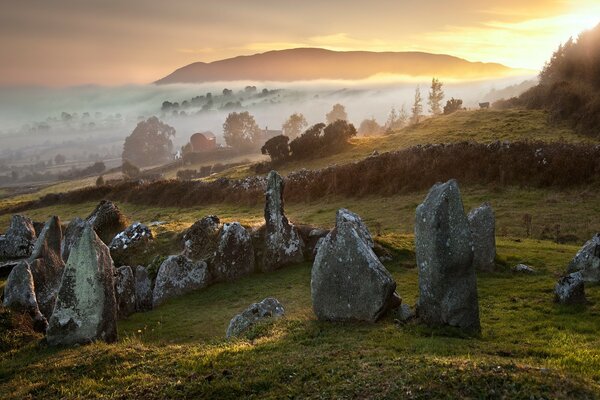 Beautiful sunset on the background of stones